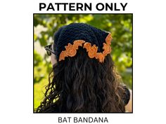 a woman with long hair wearing a crochet bat headband