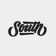 the word south is written in black ink on a white background with an orange and blue stripe