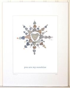 a white frame with some rocks in it and the words you are my sunshine on it