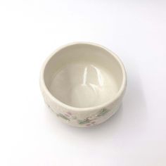 a white bowl sitting on top of a table