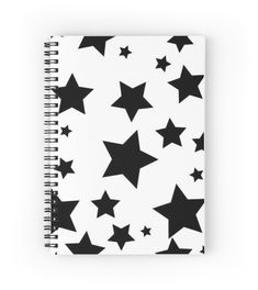 a spiral notebook with black stars on it