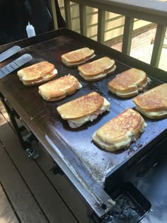 panini sandwiches cooking on an outdoor grill