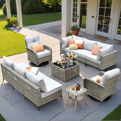 an outdoor living area with wicker furniture