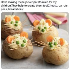 four baked potatoes with carrots and peas on them are arranged in the shape of mice