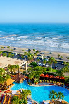 an aerial view of the beach and pool area