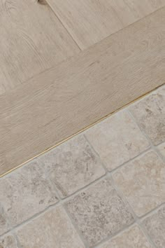 a white toilet sitting on top of a tiled floor