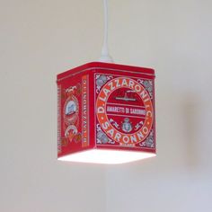 a red light fixture hanging from the ceiling