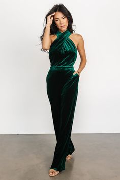 Elevate your style with our dark green velvet jumpsuit, a luxurious and chic choice that captures the essence of sophistication. This jumpsuit's sumptuous velvet fabric and rich green hue make it the perfect outfit for a standout and fashionable look. Fitted Green Halter Neck Jumpsuit, Fitted Velvet Jumpsuit For Party, Fitted Velvet Jumpsuits And Rompers For Party, Velvet Jumper, Emerald Green Velvet, Velvet Drapes, Colorful Jumpsuit, Velvet Jumpsuit, One Shoulder Jumpsuit