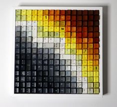 a multicolored keyboard is displayed on a white surface