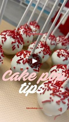 red and white cake pops with sprinkles are on the table next to each other