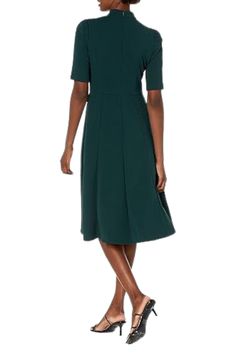 Donna Morgan Mock Neck Crepe Fit and Flare Dress | Available at Curated Brands in Los Angeles Form-fitting Dark Green Dress For Wedding, Fitted Dark Green Dress For Wedding, Fitted Dark Green Wedding Dress, Green A-line Dress With Fitted Bodice, Chic Fitted Dark Green Dress, Fitted Dark Green Midi Dress For Spring, Green Fit And Flare Evening Dress, Green Midi Dress With Fitted Bodice And Short Sleeve, Green Fit And Flare Dress For Evening