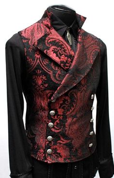 "An elegant double breasted vest for formal occasions. A fitted vest made in rich red and black tapestry fabric with a stand up top collar and wide sweeping lapels. Fastens on the inside with a sturdy button and buttons on the outside with five engraved metal buttons. The vest back and inside lining is made from rich black satin. Comes in sizes small-XXXL. Wonderful! Measurements: Small: Chest 39\" Stomach 36\" Waist 34\" Medium: Chest 42\" Stomach 38\" Waist 36\" Large: Chest 44\" Stomach 42\" Vampire Aristocrat, Gothic Fashion Men, Vest Clothes, Red Tapestry, Tapestry Vest, Black Tapestry, Vampire Costumes, Fitted Vest, Victorian Age