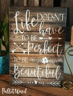 a wooden sign that says, life doesn't have to be perfect but beautiful