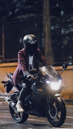 a man riding on the back of a motorcycle