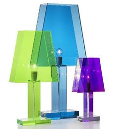 three different colored lamps sitting next to each other