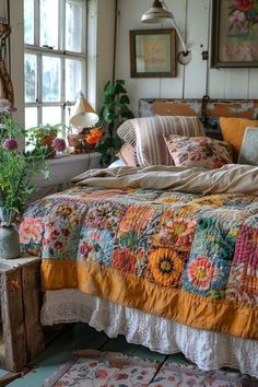 a bed sitting in a bedroom next to a window with lots of flowers on it