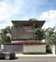 a car parked in front of a building with flowers growing on the side of it