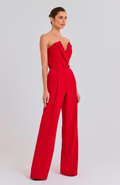 Turn heads in this fiery strapless jumpsuit designed with a slender belt and wide legs. 50 1/2" center front length; 34" inseam; 23" leg opening (size 2) Hidden back-zip closure Strapless Removable belt Lined 100% polyester Dry clean or hand wash, dry flat Imported Red Vision Board, Senior Recital, Lady Wardrobe, Nadine Merabi, Structured Corset, Corset Boning, Designer Jumpsuits, Strapless Jumpsuit, Red Jumpsuit