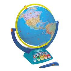 a blue and yellow children's learning globe with a pen on the table next to it