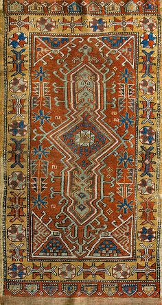 an old rug with many different colors and patterns