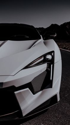 the front end of a white sports car