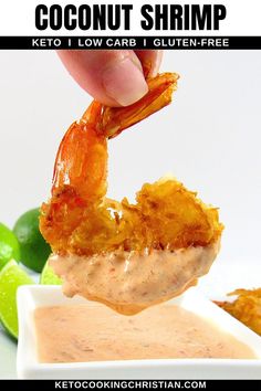 a person dipping some kind of food into a small white bowl with limes around it