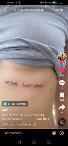 the back of a woman's stomach with an inscription on it that says eating lightning