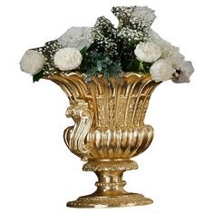 a gold vase with white flowers in it