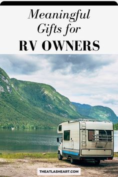 an rv parked next to a lake with mountains in the background and text overlay reading,