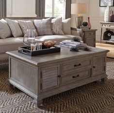 The Easy Bay lift-top storage cocktail table is both unique and functional. It is made of 100% solid wood with a decorative shutter design on the door fronts, tapered legs, and hidden caster wheels for easy movement. With two cabinets, two drawers, and a lift-top table, the Easy Bay offers plenty of storage for games, blankets, and media essentials. Highlights Solid pine Metal hardware Dovetail gray finish Features French & English dovetail drawe Coffee Tables With Storage, Shutter Design, Coffee Tables Ideas, Diy Coffee Tables, Cheap Farmhouse, Diy Dog Bed, Coffee Table With Drawers, Coffee Table Ideas, Lift Top Coffee Table