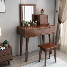 a dressing table with a mirror and stool