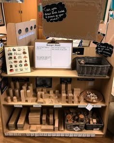 an assortment of items displayed on shelves in a classroom setting, including cards and magnets