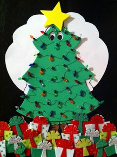 a christmas tree made out of paper with presents around it and a yellow star on top