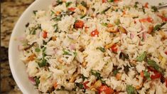 a white bowl filled with rice and vegetables