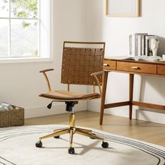 an office chair sitting on top of a wooden floor next to a desk with a window