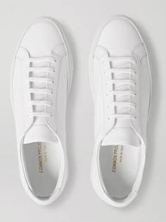 White Leather, Gold Stamped Serial Numbers, Leather Linings, Rubber Soles, Lace-up, Come With Dust Bag And Spare Laces, Made In Italy Common Projects ' 'Original Achilles' sneakers have gained cult status thanks to their minimalist design and superior construction. This white version is perfect for creating crisp city-smart looks. Wear this pair with rolled-up selvedge denim jeans and a lightweight knit for effortlessly understated flair. Shown here with Marvy Jamoke trousers, A.P.C. T-shirt, M… Common Projects Men, Common Projects Shoes, Men Shoes Casual, White Sneakers Men, Selvedge Denim Jeans, Mens Boots Fashion, Common Projects, White Leather Sneakers, Men Fashion Casual Outfits