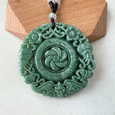 Circle Flower Swirl Necklace Stone Type: Natural Jadeite Jade (Grade A) Pendant Size: 2.15 x 2.15 x 0.26 in. Pendant Weight: ~65 to 80 g (combined) Translucency: Opaque Unique ID: GDTC-* NATURAL JADE: This is an exquisitely hand carved natural jadeite jade pendant. It is natural, un-dyed, and in its natural form. CARVING: The carving depicts a flower swirl in the middle with decorative flower patterns rotating out in the clockwise pattern. A very unique jade pendant. JADE COLOR: Green READY TO G Swirl Necklace, Jade Flower, Circle Flower, Jade Pendant Necklace, Jade Color, Cosplay Jewelry, Necklace Stone, Gems Art, Necklace Flower