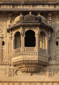 an ornate building with intricate carvings on the side