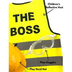 a yellow vest with the words the boss on it and an orange hard hat next to it