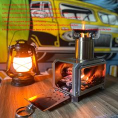 a wood burning stove sitting on top of a wooden table next to a light bulb