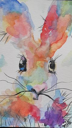 a watercolor painting of a rabbit's face