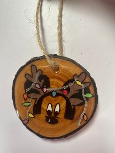 a wooden ornament with an image of mickey mouse on it