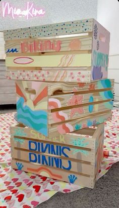 three wooden boxes stacked on top of each other with the words diyvins dining written