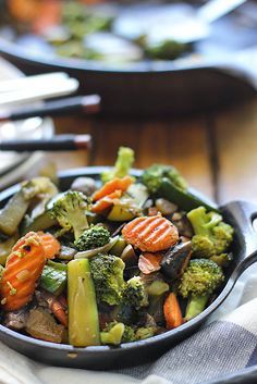 a pan filled with vegetables sitting on top of a table