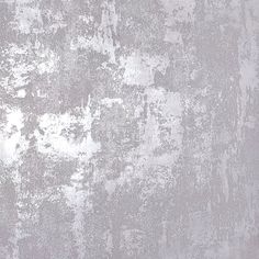 an old grungy wall with white paint on it