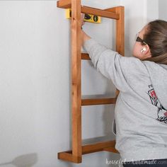 Make your home feel cozy with a DIY blanket ladder. Blanket Ladders Diy, Blanket Shelf On Wall, Diy Blanket Rack For Wall, Diy Blanket Holder On Wall, Diy Blanket Holder, Wall Mounted Blanket Storage, Blanket Wall Rack Diy, Blanket Storage Diy, Wall Blanket Rack