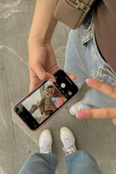 a person taking a selfie with their cell phone