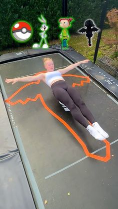 a woman laying on top of a trampoline