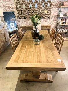 a large wooden table with chairs around it