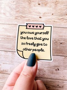 someone holding up a piece of paper that says, you give yourself the love that you so freely give to other people